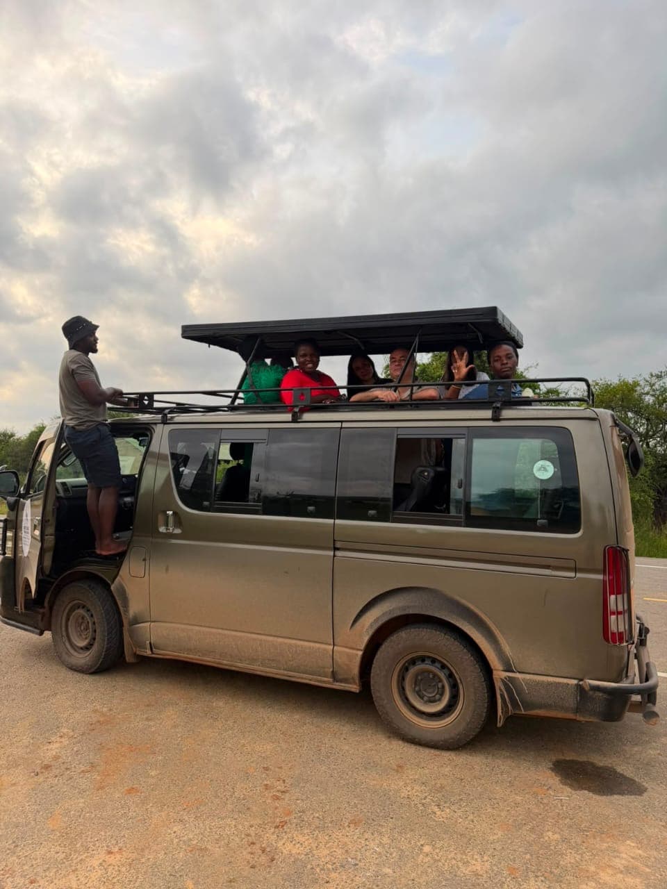Up through the roof hatch, mid game drive in Murchison Falls