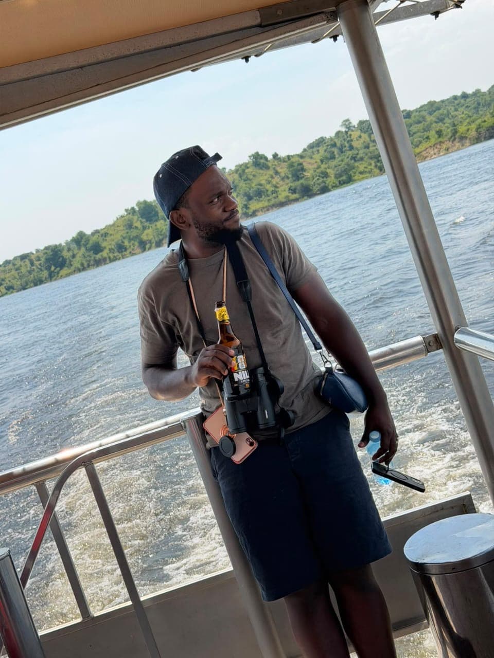 Binoculars up on the river, our guide reading the bank for game
