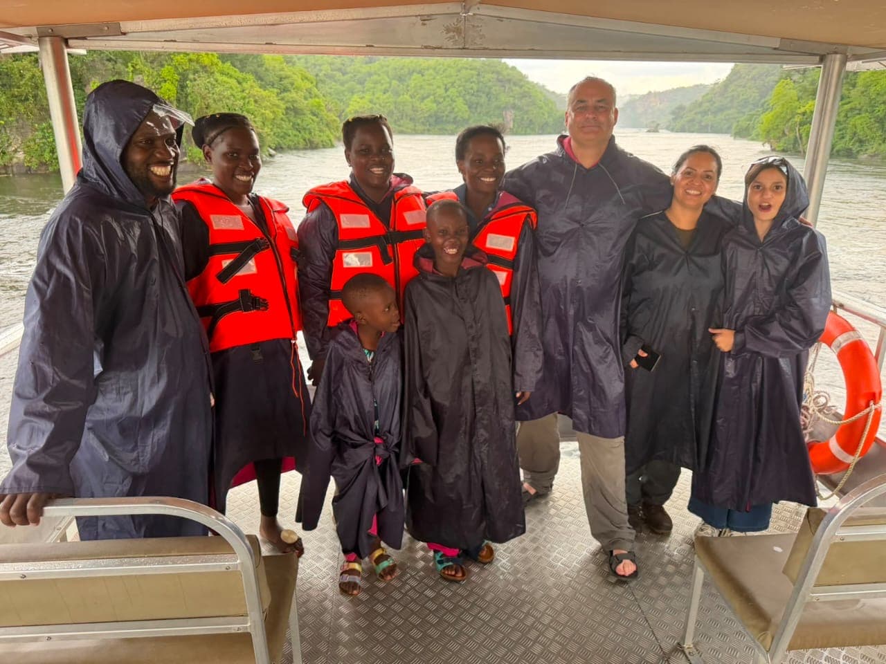 Ponchos on for the Victoria Nile boat cruise — the spray reaches the deck