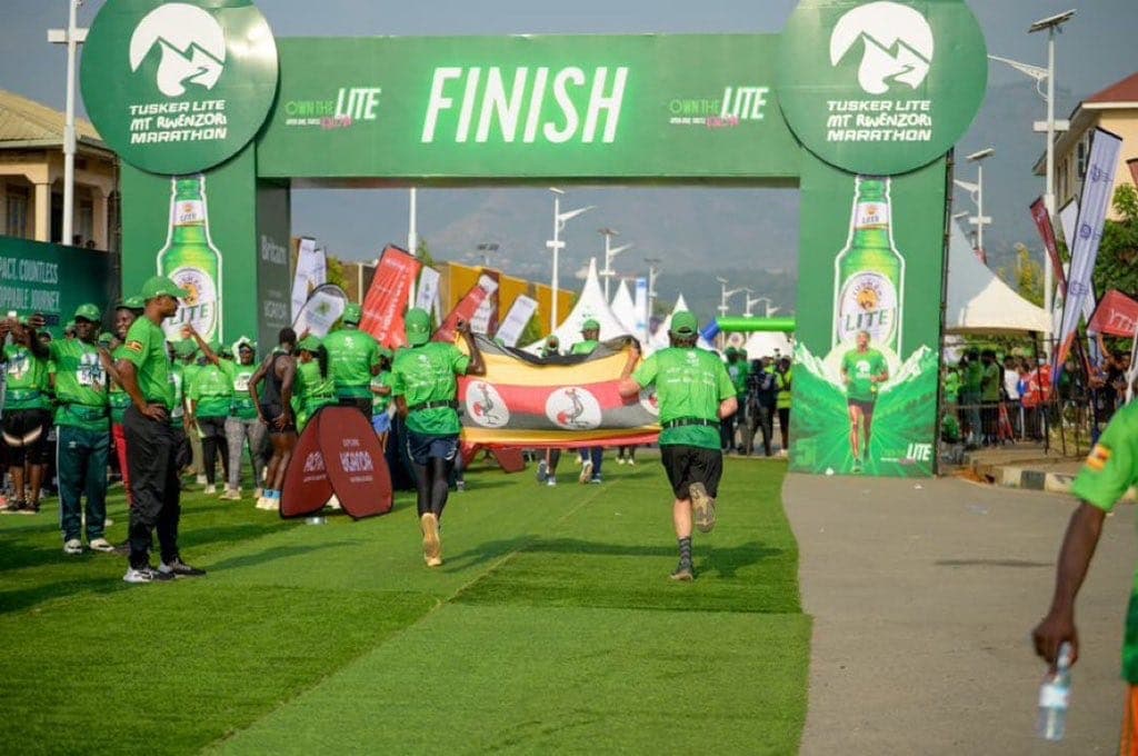 The flag comes home — finishers on the green at the end of the course